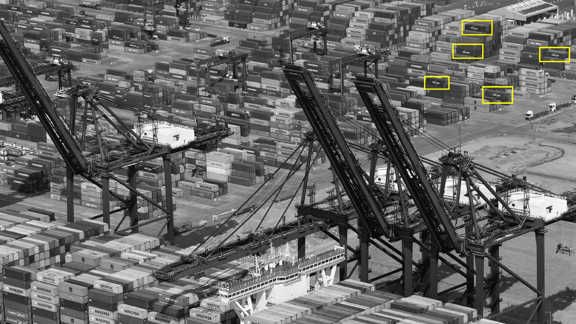 “Container ship aerial image - The MSC Tina at Felixstowe docks" by John Fielding, used under CC BY 2.0 / Cropped, desaturated, resampled and recoloured from original