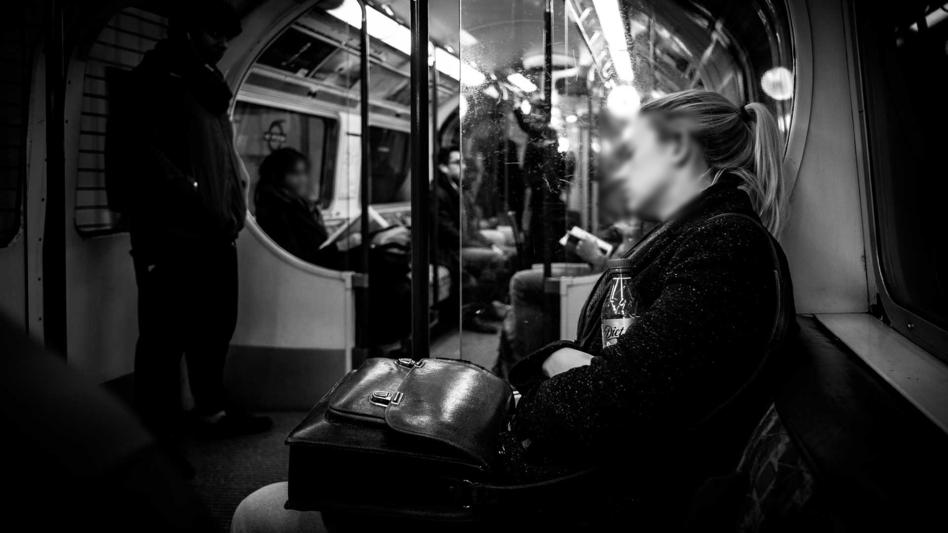 "After work - London, England - Black and white street photography" by Giuseppe Milo, used under CC BY 2.0 / Resampled from original